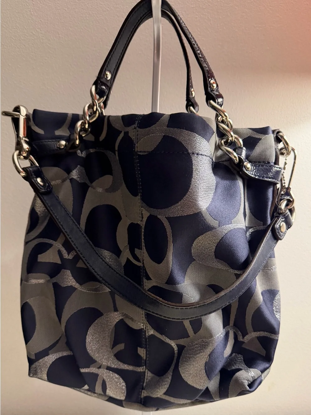 Coach navy , gray & metallic silver signature jacquard with navy leather trim.